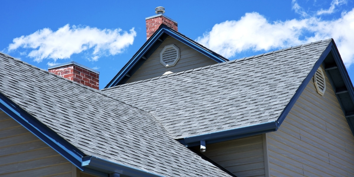 A close-up view of a newly installed roof in winter conditions, showcasing durable shingles designed for Louisiana and Mississippi homes.